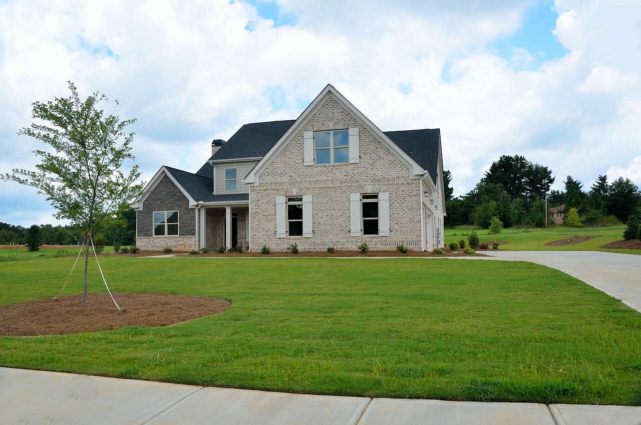 A newly built brick two-story house on a fresh lot